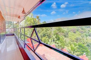Balkón nebo terasa v ubytování Collection O Kunchithanny Road Munnar Formerly Indeevaram Resort + 27 fotografií