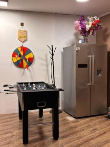 a chess table in front of a refrigerator at Anna's guesthouse in Rīga