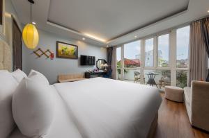 Postel nebo postele na pokoji v ubytování Golden Amour Hotel + 75 fotografií
