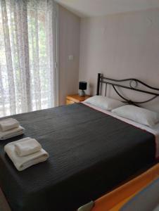 Ένα ή περισσότερα κρεβάτια σε δωμάτιο στο Christina Apartment