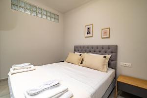 Ένα ή περισσότερα κρεβάτια σε δωμάτιο στο Electra's apartments