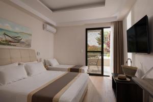 Postel nebo postele na pokoji v ubytování Hotel Rema