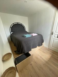 a bedroom with a bed in a room with a door at Appart T2 Bidart Plage Huabia in Bidart