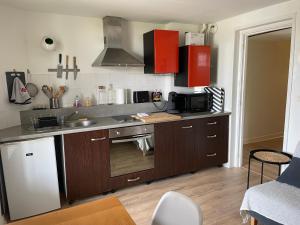 a kitchen with a sink and a stove top oven at Appart T2 Bidart Plage Huabia in Bidart +4 photos