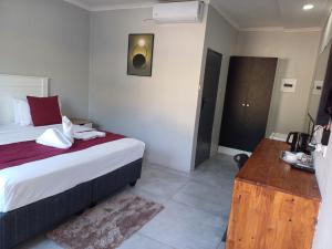 Postel nebo postele na pokoji v ubytování Chobe Blue Guest Inn