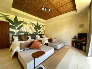 TV a/nebo společenská místnost v ubytování Manggadiwa Resort and Spa