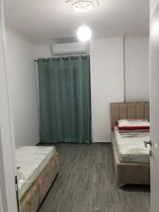 Postel nebo postele na pokoji v ubytování Relux Rezidenc , Shkoze