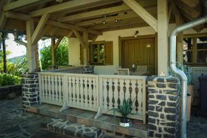 a house with a porch with a wooden roof at Hill & Chill in Káptalantóti +10 photos