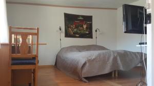 En eller flere senge i et værelse på Room In Gedser Centrum