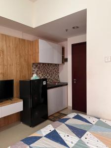 Η κουζίνα ή μικρή κουζίνα στο Studio Room at Taman Melati