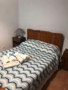 En eller flere senge i et værelse på Casa do Ceira