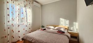 Postel nebo postele na pokoji v ubytování BELLA NINA APARTMENT