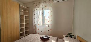 Postel nebo postele na pokoji v ubytování BELLA NINA APARTMENT