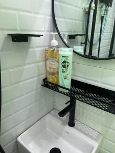 a bathroom with a sink and a mirror at Homestay Armandz 3 bedrooms house in Masjid Tanah