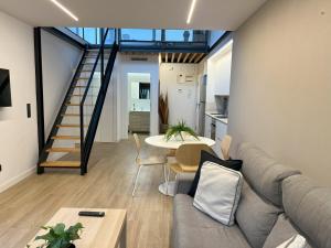 a living room with a couch and a table at Apartamentos Romero in Alicante