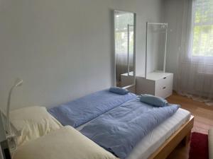 Ένα ή περισσότερα κρεβάτια σε δωμάτιο στο EnjoyLucerne