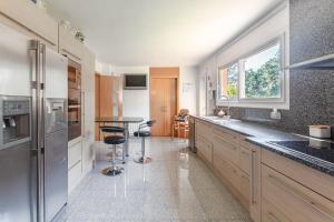 a kitchen with a counter and a table in it at Villa Sol in La Canyera