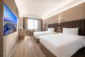 IntercityHotel Shanghai Hongqiao Airport - Free Minibar for First Night客房内的一张或多张床位