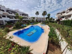 an overhead view of a swimming pool at a resort at Cocoonly in San Juan de los Terreros