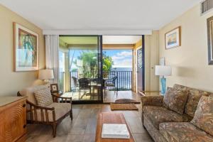 a living room with a couch and a table at KIHEI BEACH, #210 condo in Kihei