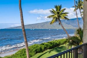 a view of the ocean from the balcony of a resort at KIHEI BEACH, #210 condo in Kihei