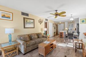 a living room with a couch and a table at KIHEI BEACH, #210 condo in Kihei +30 photos