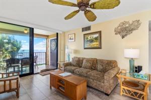 a living room with a couch and a ceiling fan at KIHEI BEACH, #210 condo in Kihei