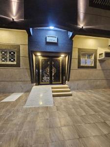 a building with a door with a rug in front of it at Welcome Two 5km far from Masjid Nabawi in Al Madinah