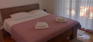 Letto o letti in una camera di Mimice View