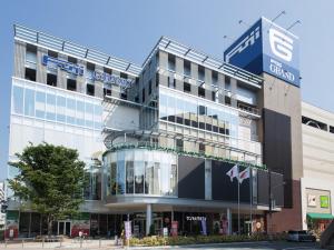 a building with a sign on the side of it at Lion Tsurumi in Hiroshima