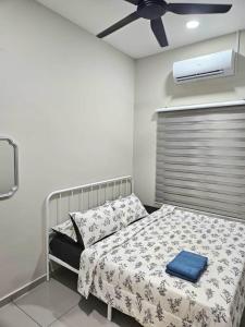 Ένα ή περισσότερα κρεβάτια σε δωμάτιο στο Adam Homestay