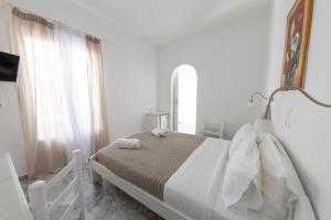 Voodi või voodid majutusasutuse Hotel Manos toas