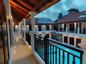 a view of the balcony of a house with a swimming pool at Grand Leisure Care & Wellness Resort in Negombo