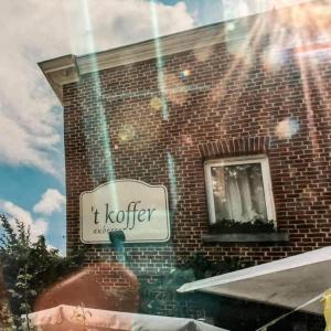 a sign on the side of a brick building at B&B Auberge 't Koffer in Eijsden +8 photos