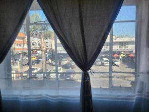 a window with a view of a parking lot at Beautiful View House in Vosburg