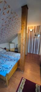 Postel nebo postele na pokoji v ubytování Joós Apartman