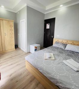 Postel nebo postele na pokoji v ubytování New Batumi