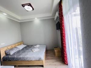 Postel nebo postele na pokoji v ubytování New Batumi