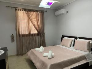 Postel nebo postele na pokoji v ubytování Gogo Apartment