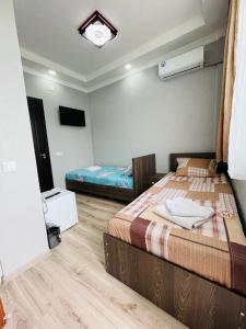 Postel nebo postele na pokoji v ubytování New Batumi
