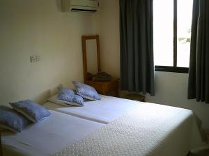 Postel nebo postele na pokoji v ubytování Panklitos Tourist Apartments
