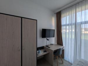 TV a/nebo společenská místnost v ubytování Die Remise Herold + 2 fotografie