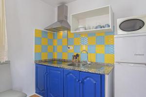 Kuchyň nebo kuchyňský kout v ubytování Apartamento Villa Mayo A