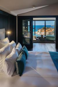 Postel nebo postele na pokoji v ubytování Villa Geba Boutique Hotel