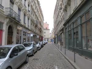 a row of cars parked on a street with buildings at NOCNOC - Le Rayonnant in Lyon