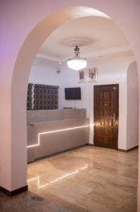 A television and/or entertainment centre at Skyrock Hotels Ogba