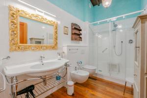 a bathroom with a sink and a shower and a toilet at I Palpiti - Dream Villa in Florence in Florence +37 photos
