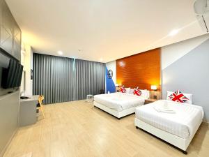 Postel nebo postele na pokoji v ubytování Asawann Hotel Suvarnabhumi