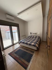 Postel nebo postele na pokoji v ubytování Fey Townhouse