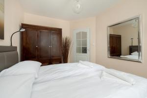 Кровать или кровати в номере Gieldowa by Solarento +20 фотографий